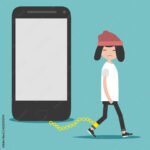 Sad child chained to giant phone representing children mobile addiction